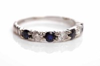Lot 310 - SAPPHIRE AND DIAMOND SEVEN STONE RING set with...