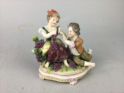 Lot 134 - A SITZENDORF FIGURE GROUP OF A BOY AND GIRL EATING GRAPES