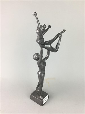 Lot 395 - A WHITE METAL SCULPTURE GROUP OF DANCING FIGURES