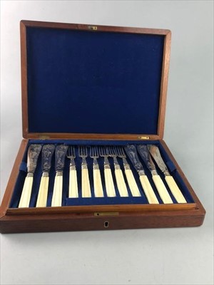 Lot 397 - A SET OF PLATED FISH KNIVES AND FORKS IN AN OAK CASE