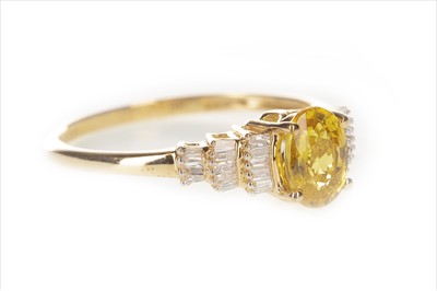 Lot 386 - A YELLOW SAPPHIRE AND DIAMOND RING