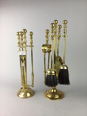 Lot 437 - A LOT OF TWO BRASS FIRE COMPANIONS