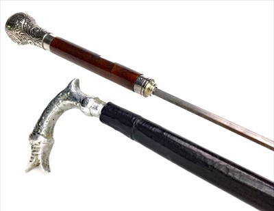 Lot 1662 - AN EARLY 20TH CENTURY CONTINENTAL SILVER MOUNTED SWORD STICK ALONG WITH ANOTHER
