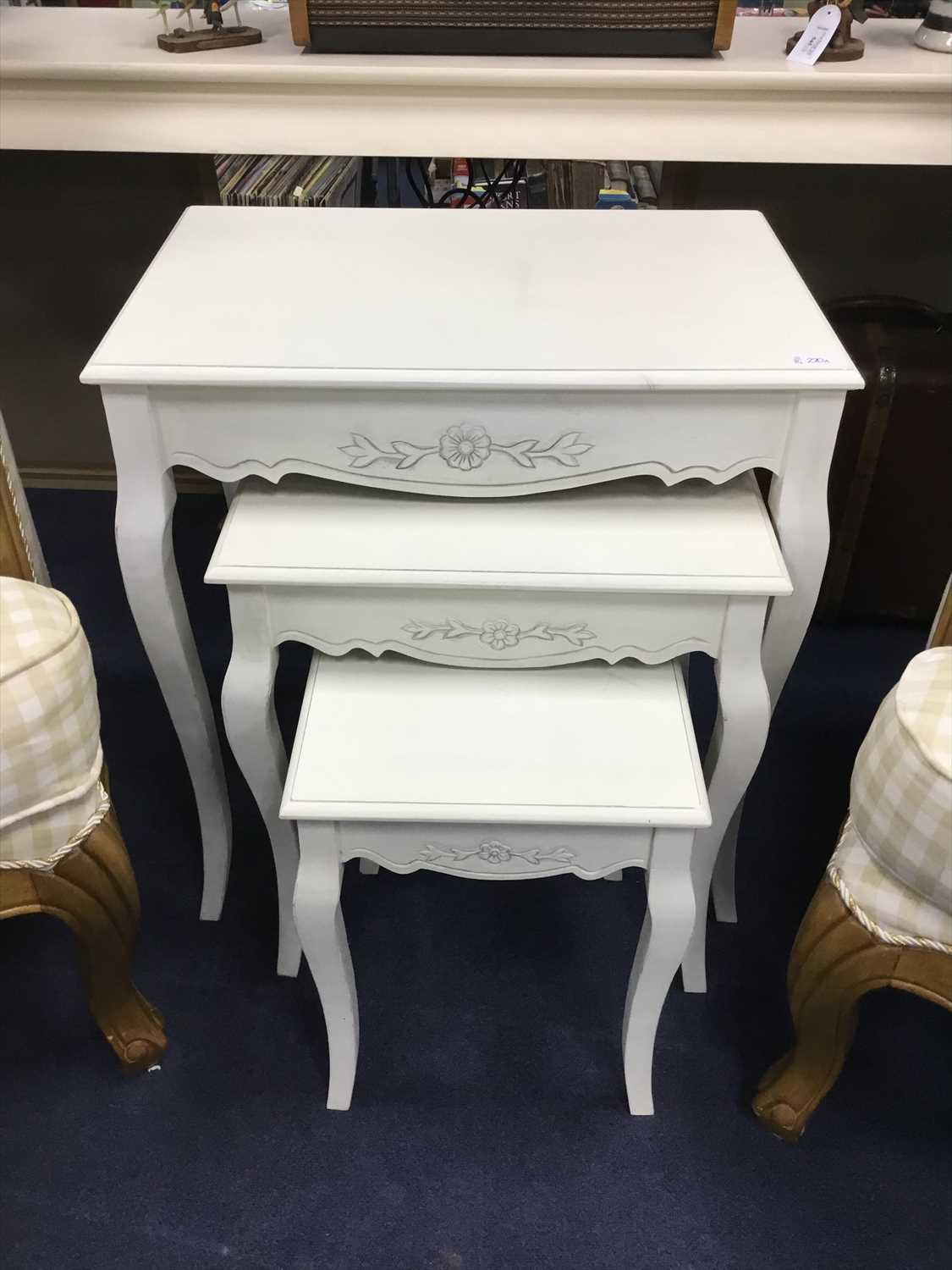 Lot 220 - A MODERN CREAM PAINTED NEST OF THREE TABLES