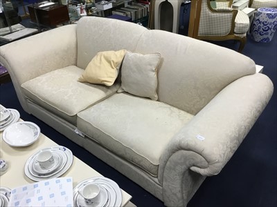 Lot 250 - A PAIR OF MODERN CREAM UPHOLSTERED THREE SEAT SETTEES