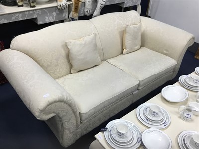 Lot 250 - A PAIR OF MODERN CREAM UPHOLSTERED THREE SEAT SETTEES