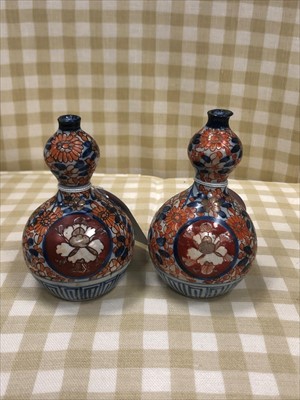 Lot 583 - A PAIR OF IMARI DOUBLE GOURD VASES