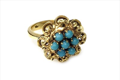 Lot 410 - A TURQUOISE DRESS RING
