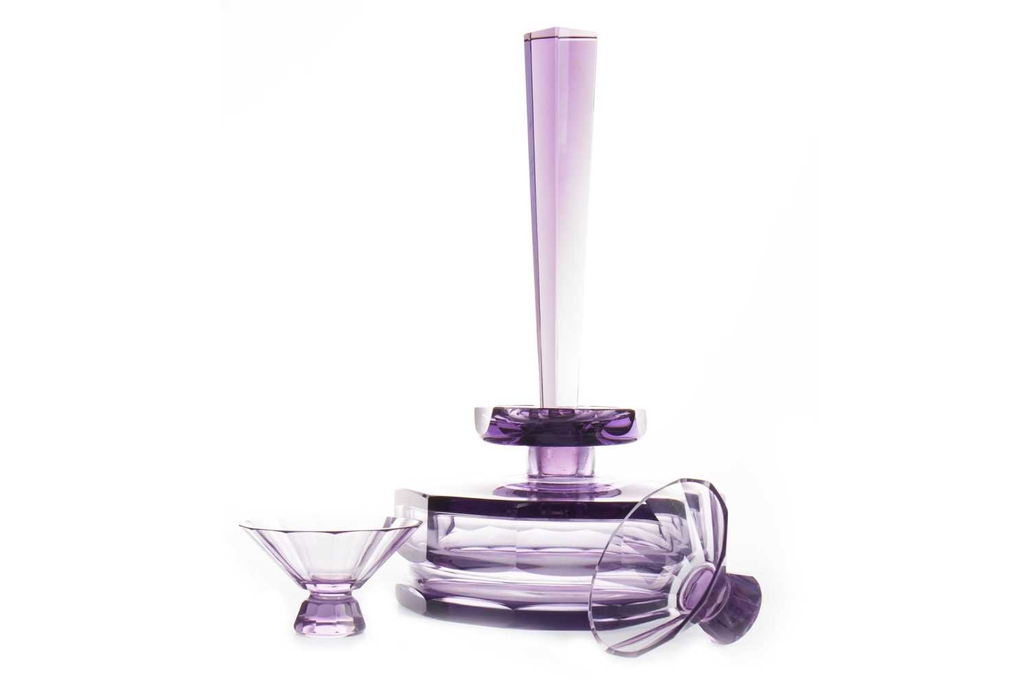 Lot 1035 - AN ART DECO AMETHYST GLASS DECANTER AND TWO GLASSES