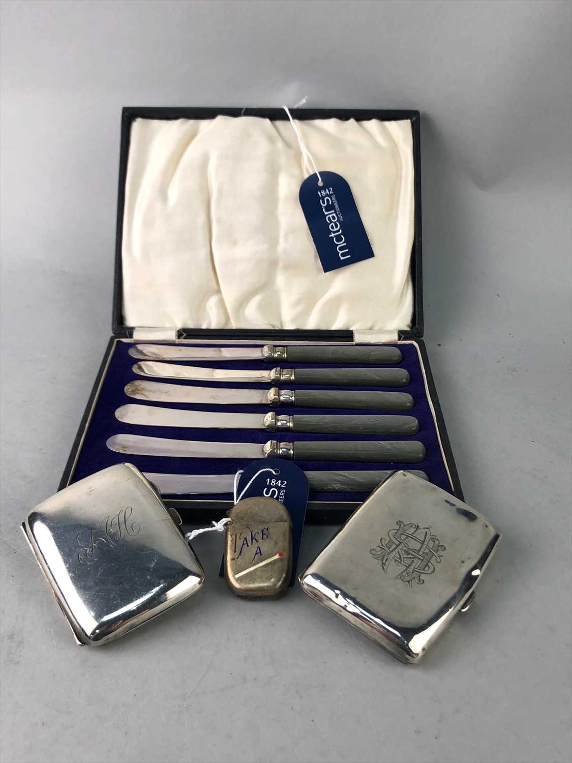 Lot 9 - A SILVER AND ENAMEL VESTA CASE, CIGARETTE CASES AND KNIVES