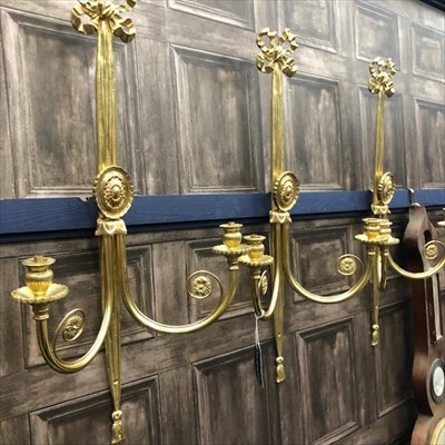 Lot 415 - A SET OF THREE GILDED METAL TWIN BRANCH WALL SCONCES