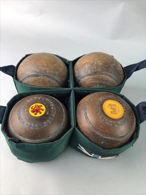 Lot 418 - A SET OF FOUR LIGNUM VITAE LAWN BOWLS