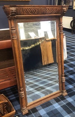 Lot 389 - A LATE VICTORIAN OAK OVERMANTEL MIRROR