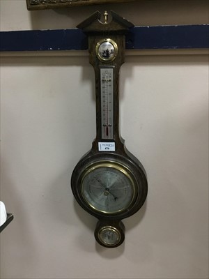 Lot 470 - A REPRODUCTION OAK BANJO BAROMETER