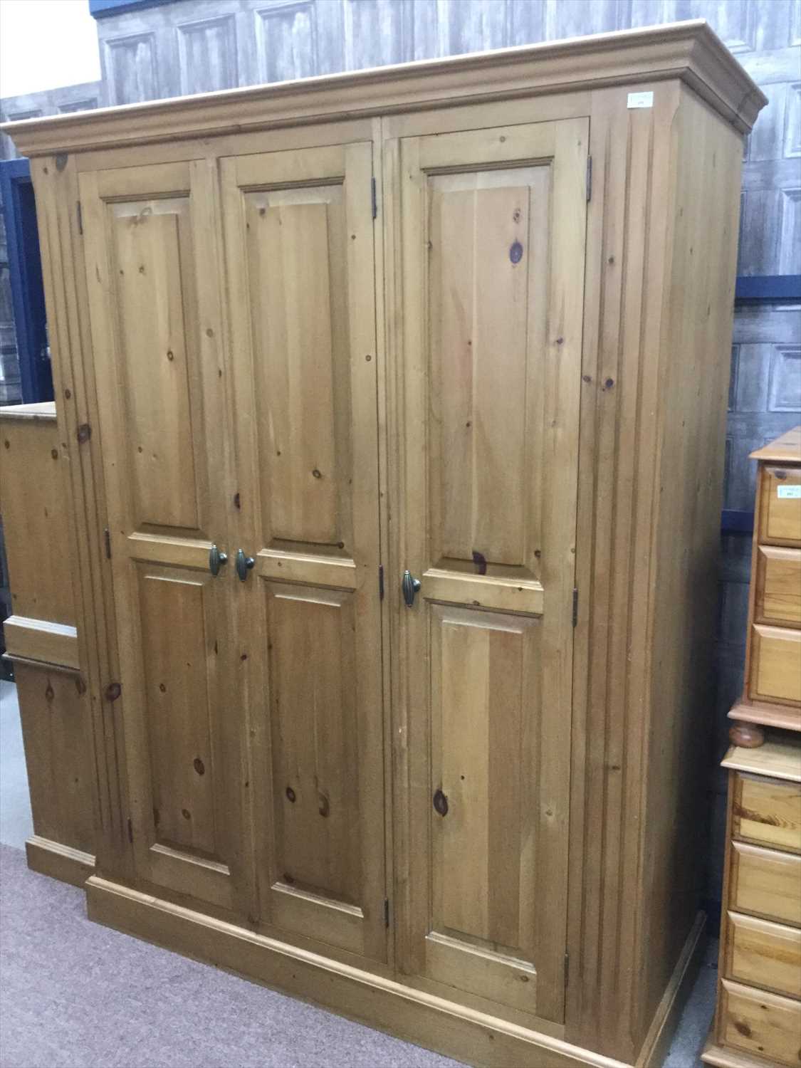 Lot 491 - A MODERN THREE DOOR PINE WARDROBE