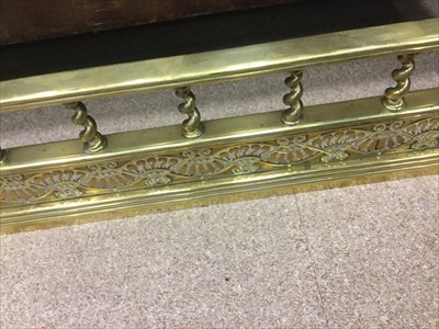 Lot 1729 - A LATE 19TH CENTURY BRASS FIRE FENDER
