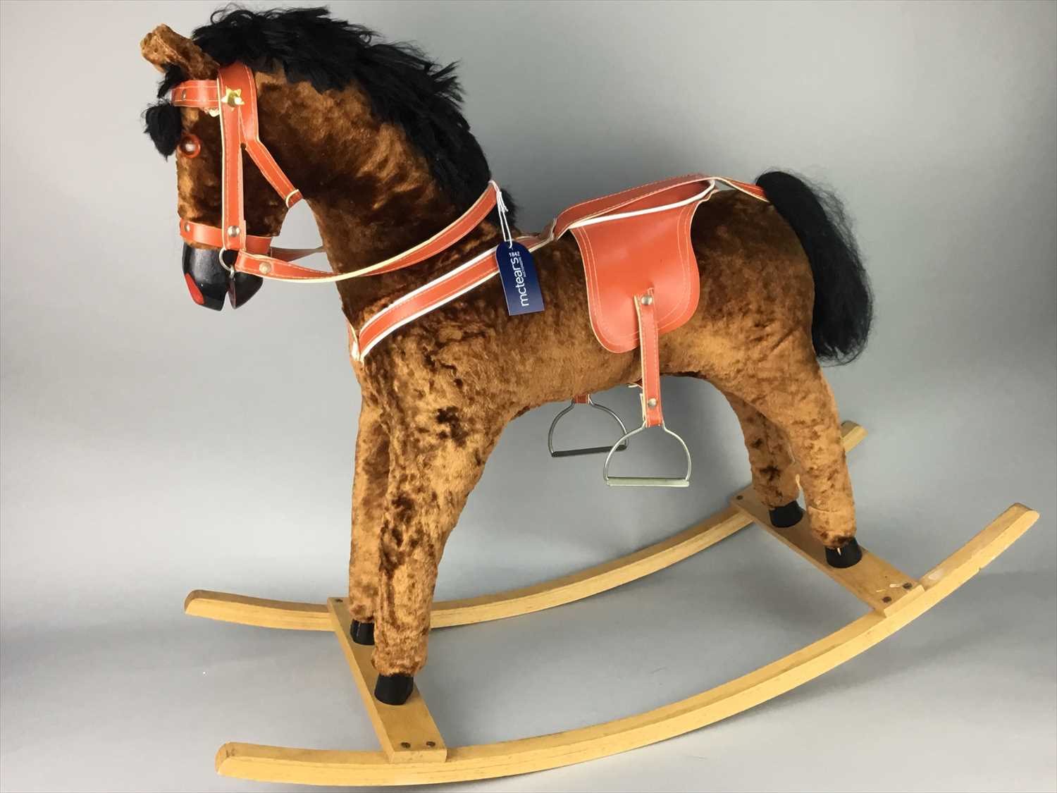 Lot 8 - AN UPHOLSTERED ROCKING HORSE