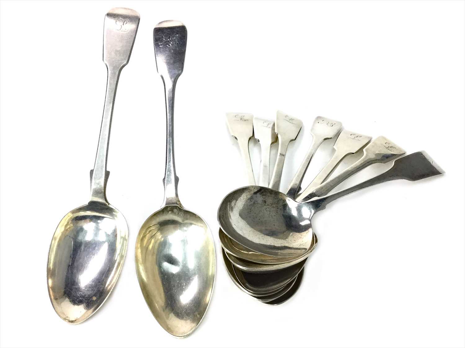 Lot 933 - A COMPOSITE SET OF NINE SILVER TABLE SPOONS