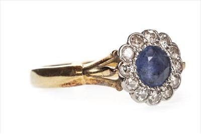 Lot 1304 - A BLUE GEM AND DIAMOND RING