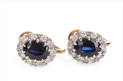 Lot 1306 - A PAIR OF BLUE GEM AND DIAMOND EARRINGS