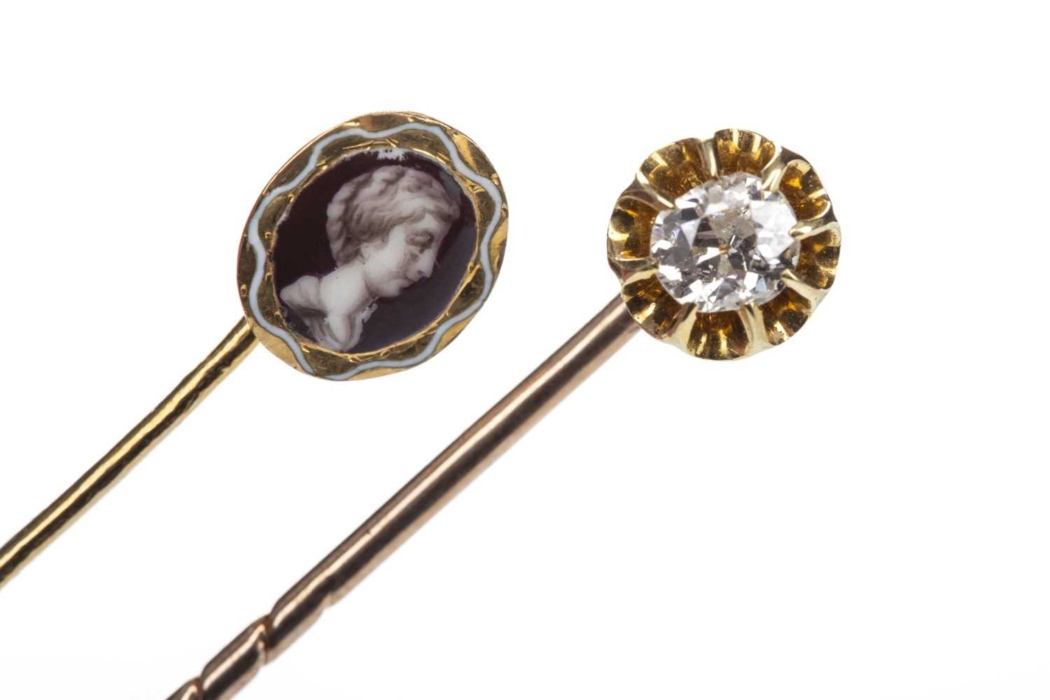 Lot 1351 - A DIAMOND SET PIN AND A PORTRAIT PIN