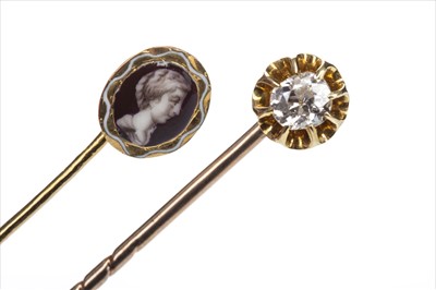 Lot 1351 - A DIAMOND SET PIN AND A PORTRAIT PIN