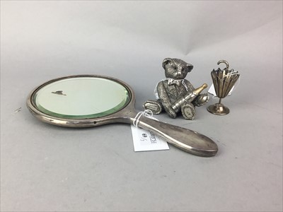 Lot 69 - A FILLED SILVER MODEL OF A BEAR ALONG WITH A HANDMIRROR AND COCKTAIL STICK HOLDER