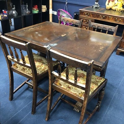 Lot 305 - AN OAK DINING TABLE AND FOUR CHAIRS