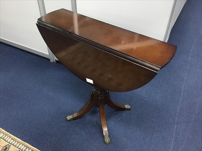 Lot 363 - A MAHOGANY CIRCULAR DROP LEAF TABLE AND AN EASTERN RUG