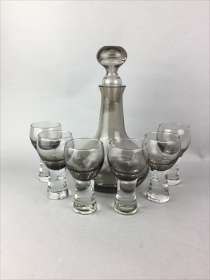 Lot 147 - A CAITHNESS SMOKED GLASS DECANTER AND SIX GLASSES AND OTHERS