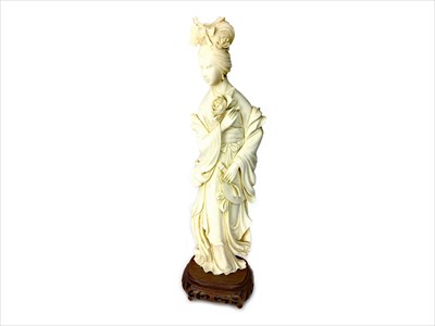 Lot 1197 - AN EARLY 20TH CENTURY CHINESE IVORY CARVING OF A FEMALE
