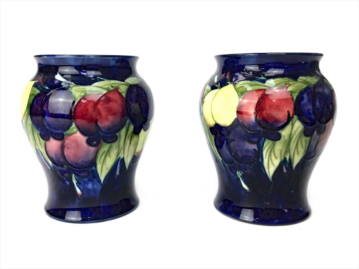 Lot 1336 - A PAIR OF MOORCROFT VASES
