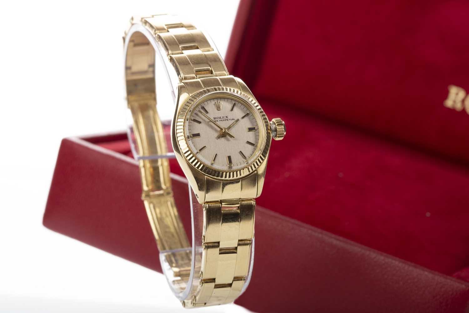 Lot 856 - A LADY'S ROLEX OYSTER PERPETUAL EIGHTEEN CARAT GOLD AUTOMATIC WRIST WATCH GOLD WATCH