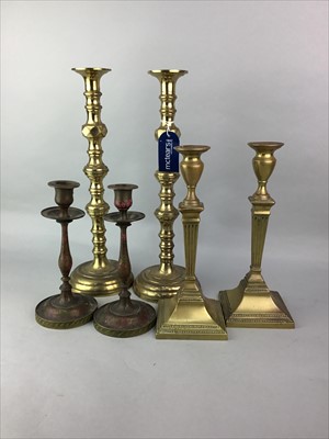 Lot 29 - A PAIR OF TALL BRASS CANDLESTICKS ALONG WITH TWO OTHER PAIRS