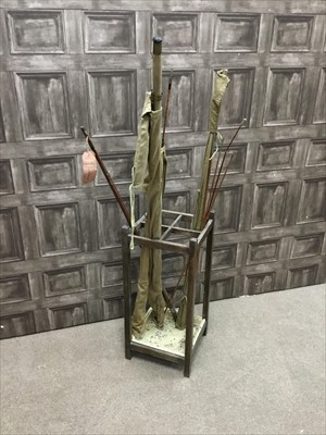 Lot 139 - A VINTAGE OAK SQUARE STICK STAND AND FISHING RODS