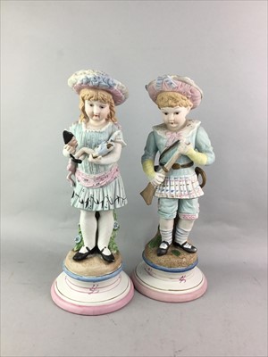 Lot 119 - A LOT OF FOUR CONTINENTAL CERAMIC FIGURES ALONG WITH A BLUE AND WHITE CHEESE DISH