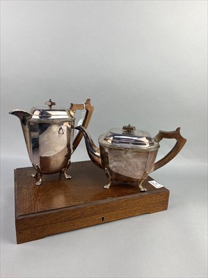 Lot 35 - AN EARLY 20TH CENTURY SILVER PLATED TEAPOT AND HOT WATER POT ALONG WITH OTHER PLATE