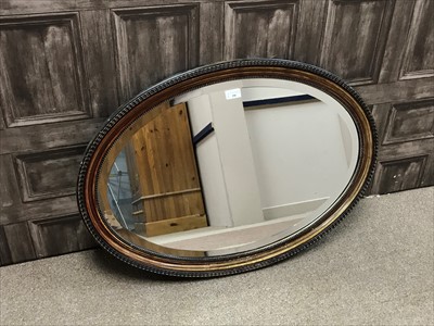 Lot 290 - A VINTAGE OVAL WALL MIRROR