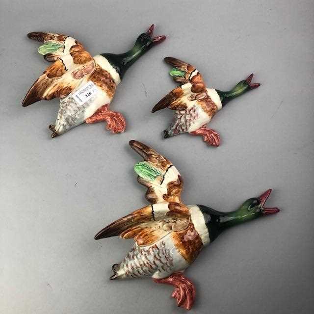 Lot 226 - A SET OF THREE FLYING BESWICK DUCKS