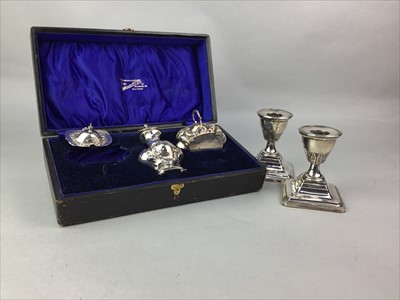 Lot 234 - A PAIR OF SILVER DWARF CANDLESTICKS ALONG WITH A CASED SILVER PART CRUET