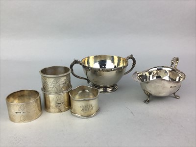 Lot 236 - A SILVER SAUCE BOAT, SUGAR BOWL AND FOUR NAPKIN RINGS