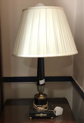 Lot 333 - AN EBONISED PILLAR LAMP