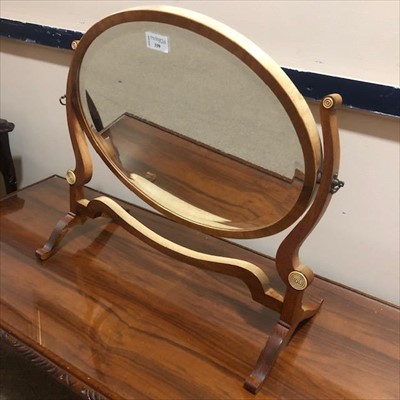 Lot 339 - A MAHOGANY OVAL DRESSING MIRROR