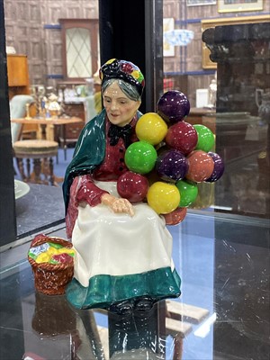 Lot 340 - A ROYAL DOULTON FIGURE OF 'THE BALLOON MAN' AND THREE OTHER ROYAL DOULTON FIGURES