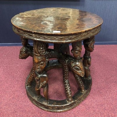 Lot 730 - AN AFRICAN CARVED WOOD CEREMONIAL TABLE