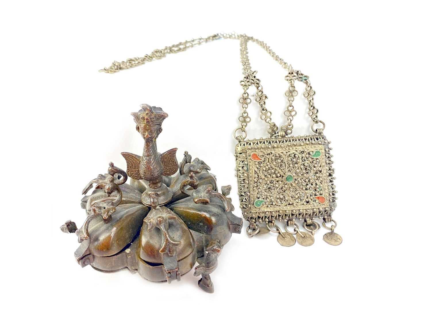 Lot 713 - AN EASTERN BRONZE SPICE BOX AND A FILIGREE PURSE