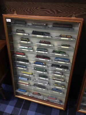 Lot 106 - A CASED COLLECTION OF MODEL TRAINS