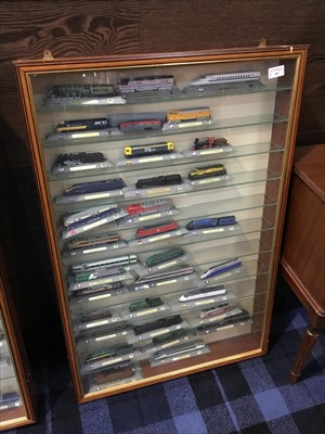 Lot 107 - A CASED COLLECTION OF MODEL TRAINS
