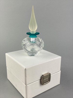 Lot 172 - A SWAROVSKI CRYSTAL BEAR TABLE CLOCK AND THREE SWAROVSKI CRYSTAL PERFUME BOTTLES