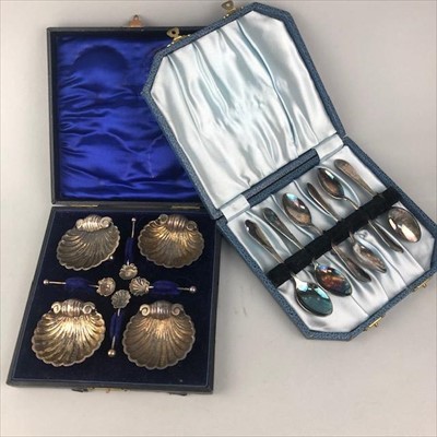 Lot 253 - A SET OF FOUR SILVER SHELL SALTS WITH SPOONS